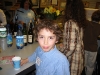 Young guest enjoying the refreshments at the artist reception.